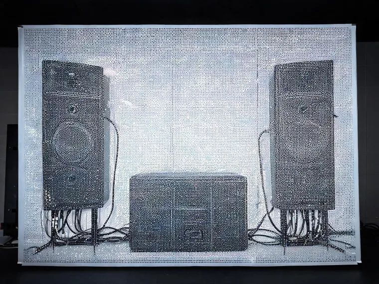 Cinema loudspeaker system behind a screen